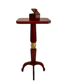 a small wooden table with a box on top
