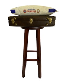 a suitcase with a bag on top of it