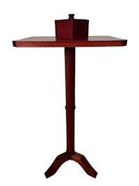 a small wooden table with a square top
